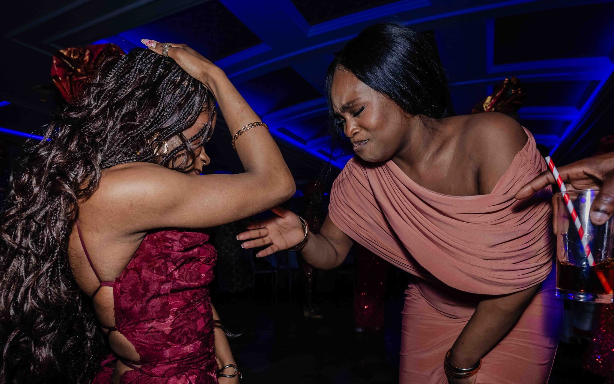 Two women lose themselves in the music on the dance floor at Vienna Woods Hotel, Cork wedding photography