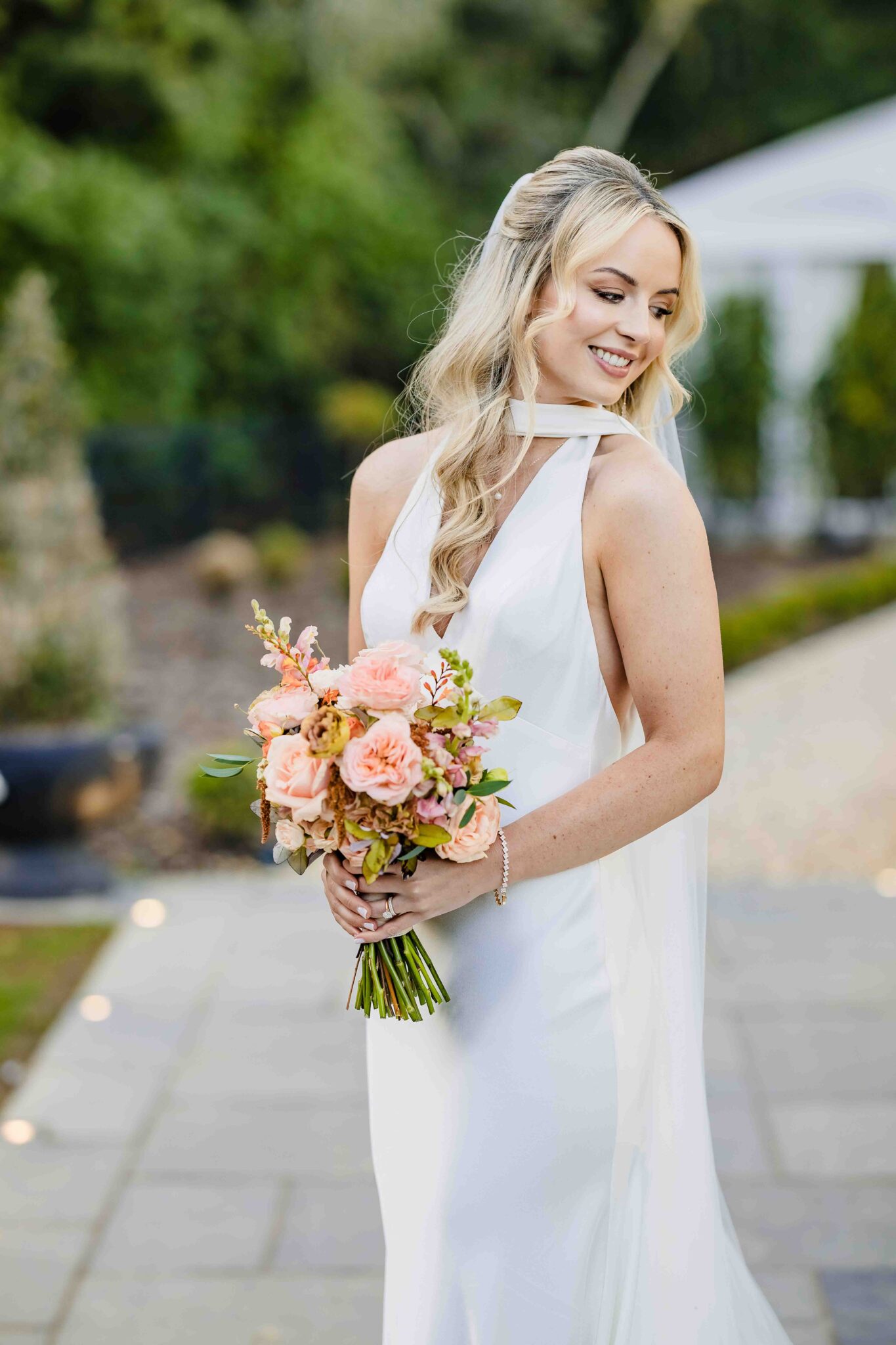 Bridal portrait of Stacey in a Folkster satin wedding dress and long veil at Vienna Woods Hotel, Cork