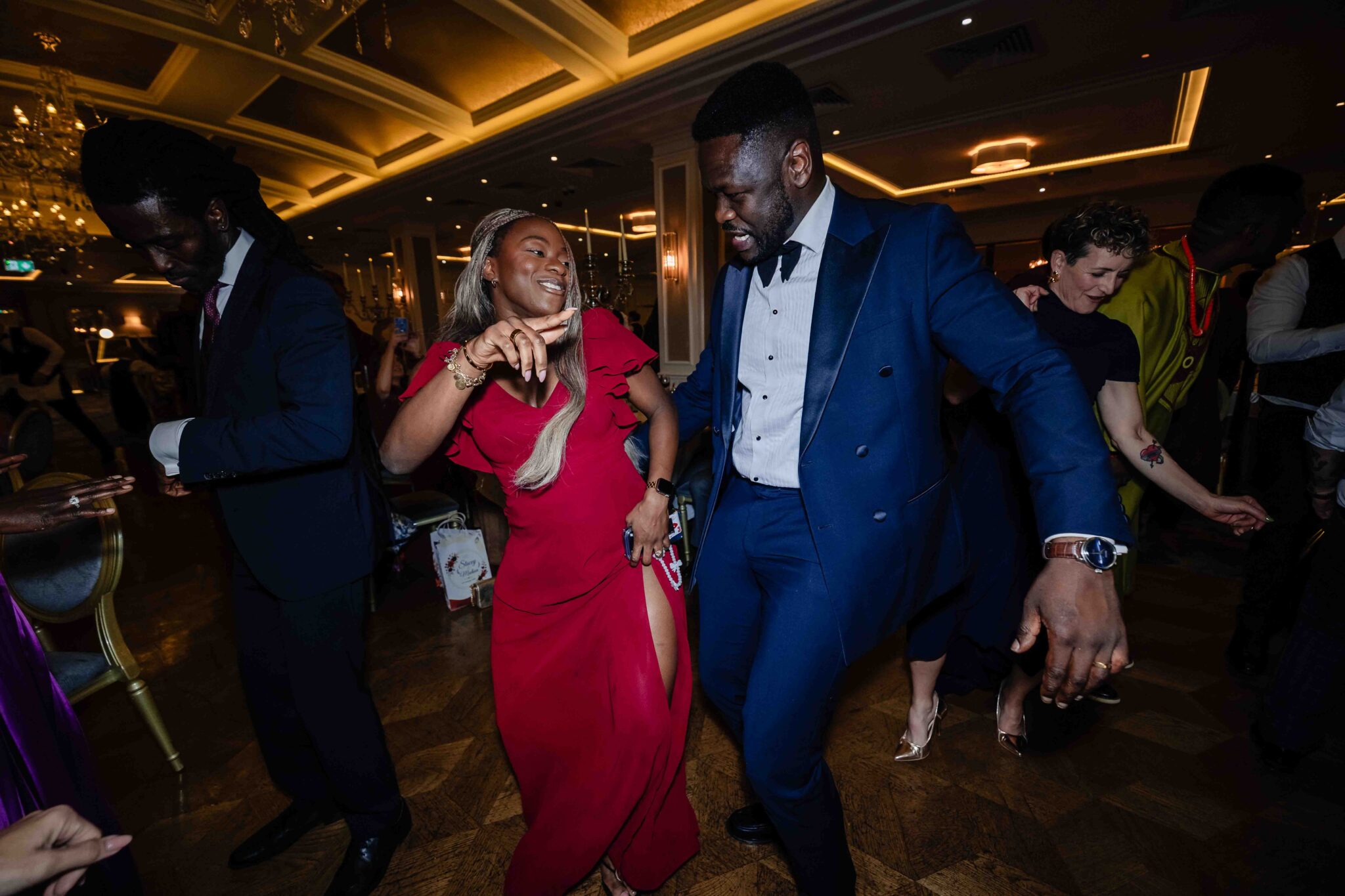 Wedding guests dance together with the dance floor full at Vienna Woods Hotel, Cork wedding photographer