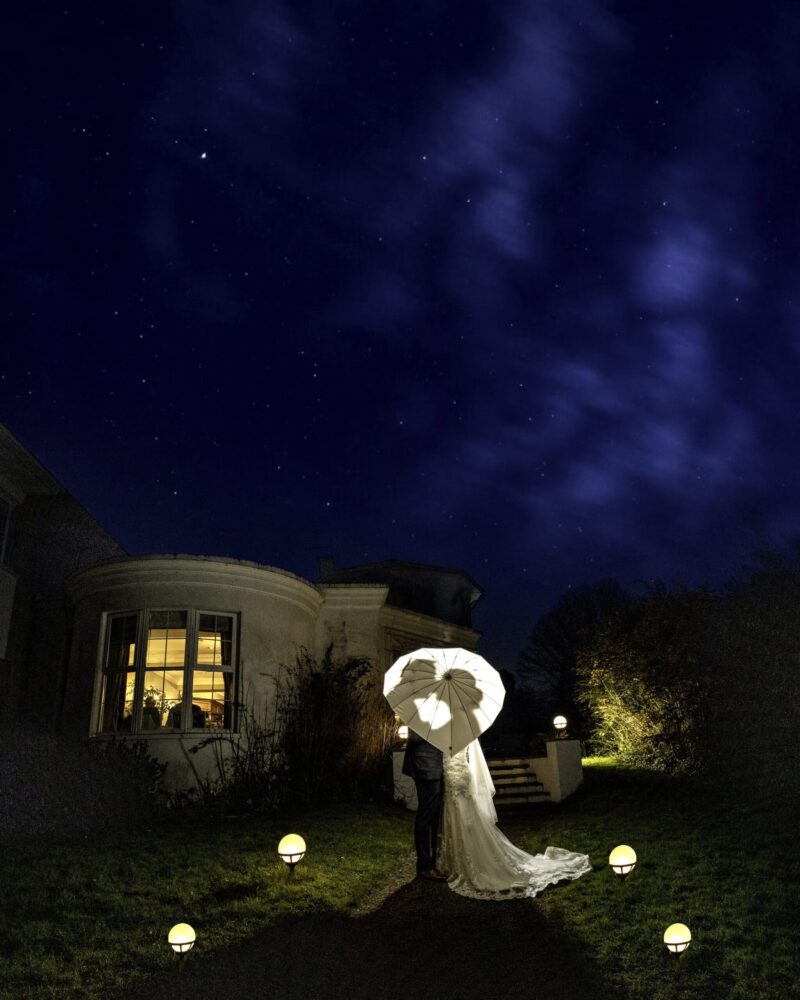 Bride smiling as she walks toward the ceremony entrance