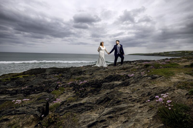 Romantic couple embracing by Gougane Barra lake, captured by Ireland vacation photographer JOD Photography