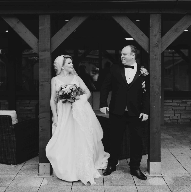bride and groom near historic country house