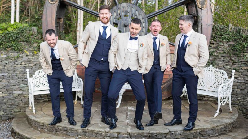 Groom and groomsmen laughing during morning prep in Kerry