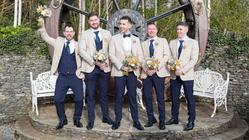 Groom and groomsmen laughing during morning prep in Kerry