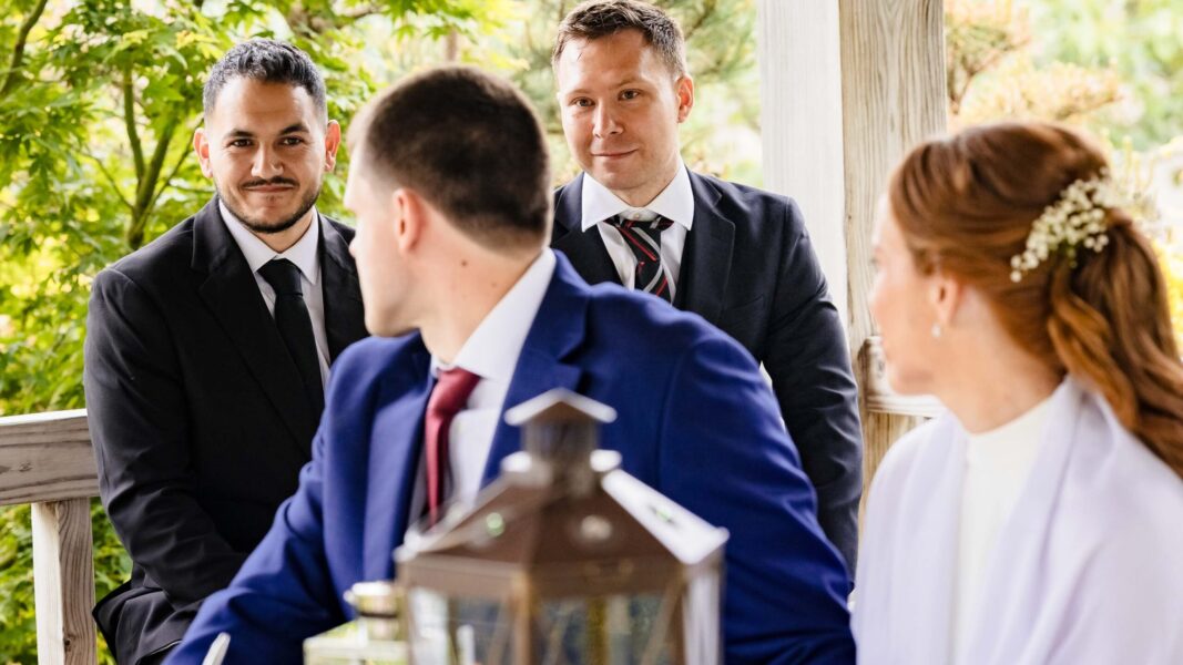 Groom smiling during intimate Irish wedding ceremony