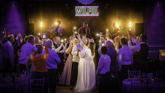 Bride and groom sharing their first dance surrounded by family and friends at an Irish wedding captured by JOD Photography