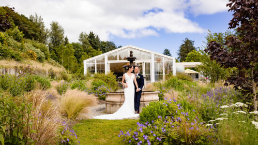 Bride smiling in the Fernhill House gardens captured by JOD Photography