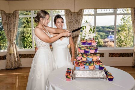 Bride and bride embracing at the Old Head of Kinsale – JOD Photography